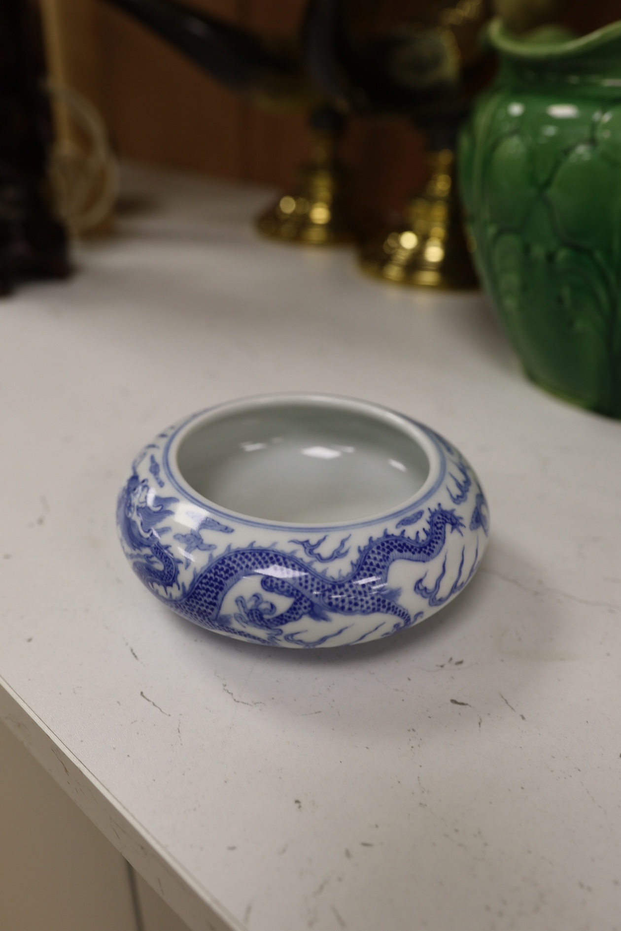 A pair of Chinese enamelled porcelain bowls, an eggshell bowl and a blue and white dragon bowl, turquoise bowls 11cm diameter (4). Condition - fair